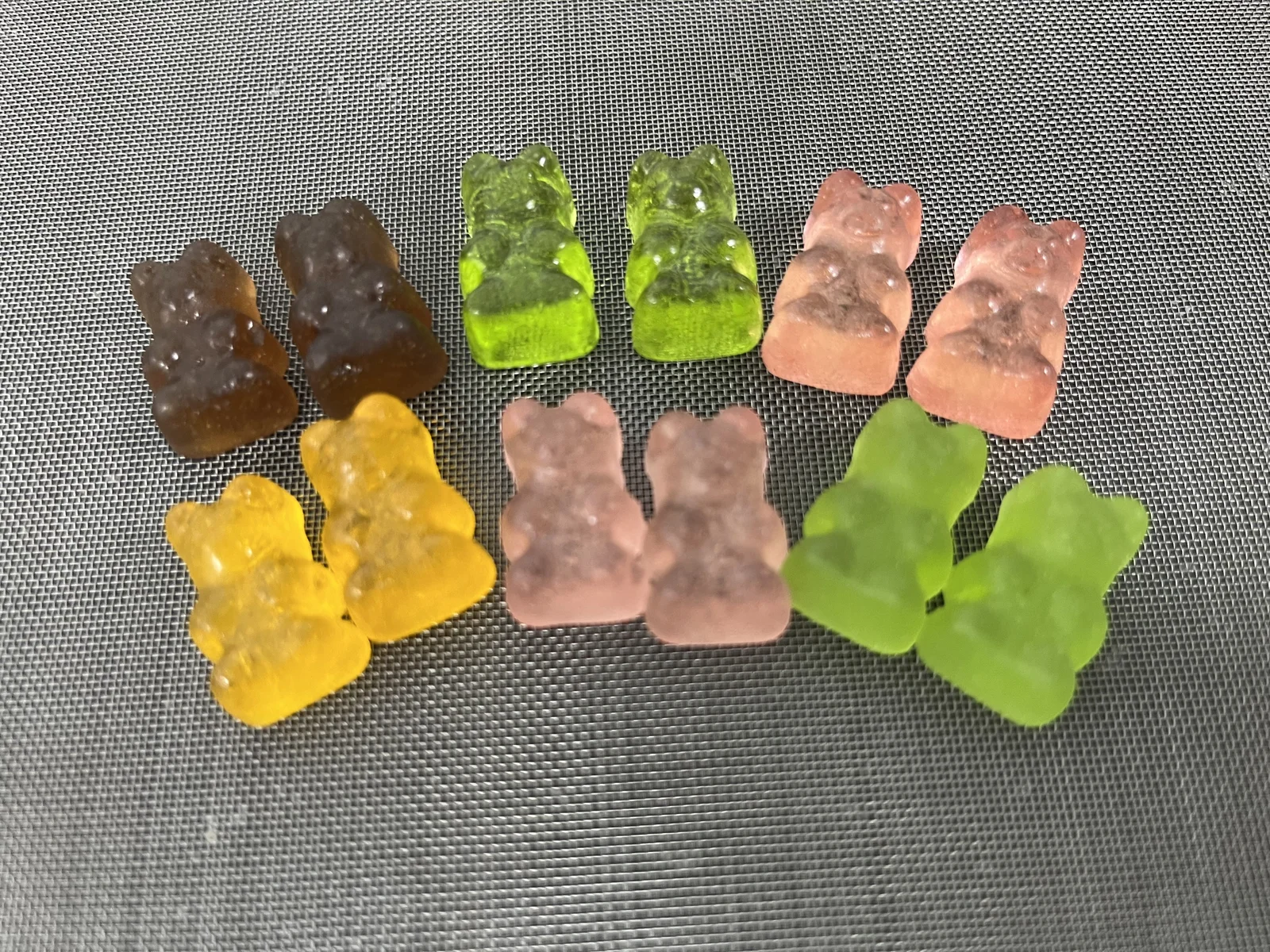 Bear-shaped gummy samples in several colors, illustrating formulation options discussed for Lactobacillus, L. reuteri and Bacillus coagulans probiotic gummy development.