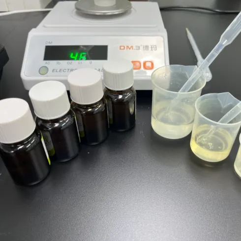 Flavor samples, droppers and laboratory beakers used by the R&D team to develop custom ashwagandha gummy taste-masking systems and herbal flavor adaptations.