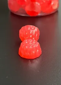 Two stacked red bear-shaped ashwagandha electrolyte gummies representing a custom sports product concept positioned for muscle and exercise support.