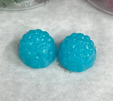 Two blue berry shaped gummy samples displayed alone for a BCAA electrolyte gummy concept