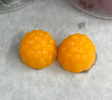 Two orange berry shaped gummy samples displayed separately for a BCAA and vitamin B6 concept