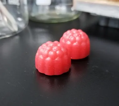 Two red berry-shaped high-dose Creatine D3 K2 Gummies using a 5 g creatine monohydrate specification and oil-phase vitamin D3/K2 premixing process designed to maintain a smooth taste.