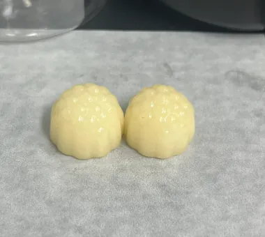 Two pale yellow sugar-free Creatine D3 K2 Gummies made with erythritol or maltitol, developed for low-calorie product positioning and zero-sugar certification support.