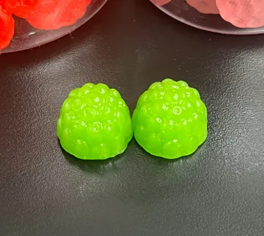 Bright green gummy samples for lime citrus creatine gummy flavor development