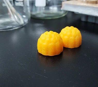Orange creatine gummy samples developed for sports nutrition supplement projects