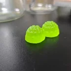 Bright green sour apple-flavored creatine gummy samples developed for private label supplement projects