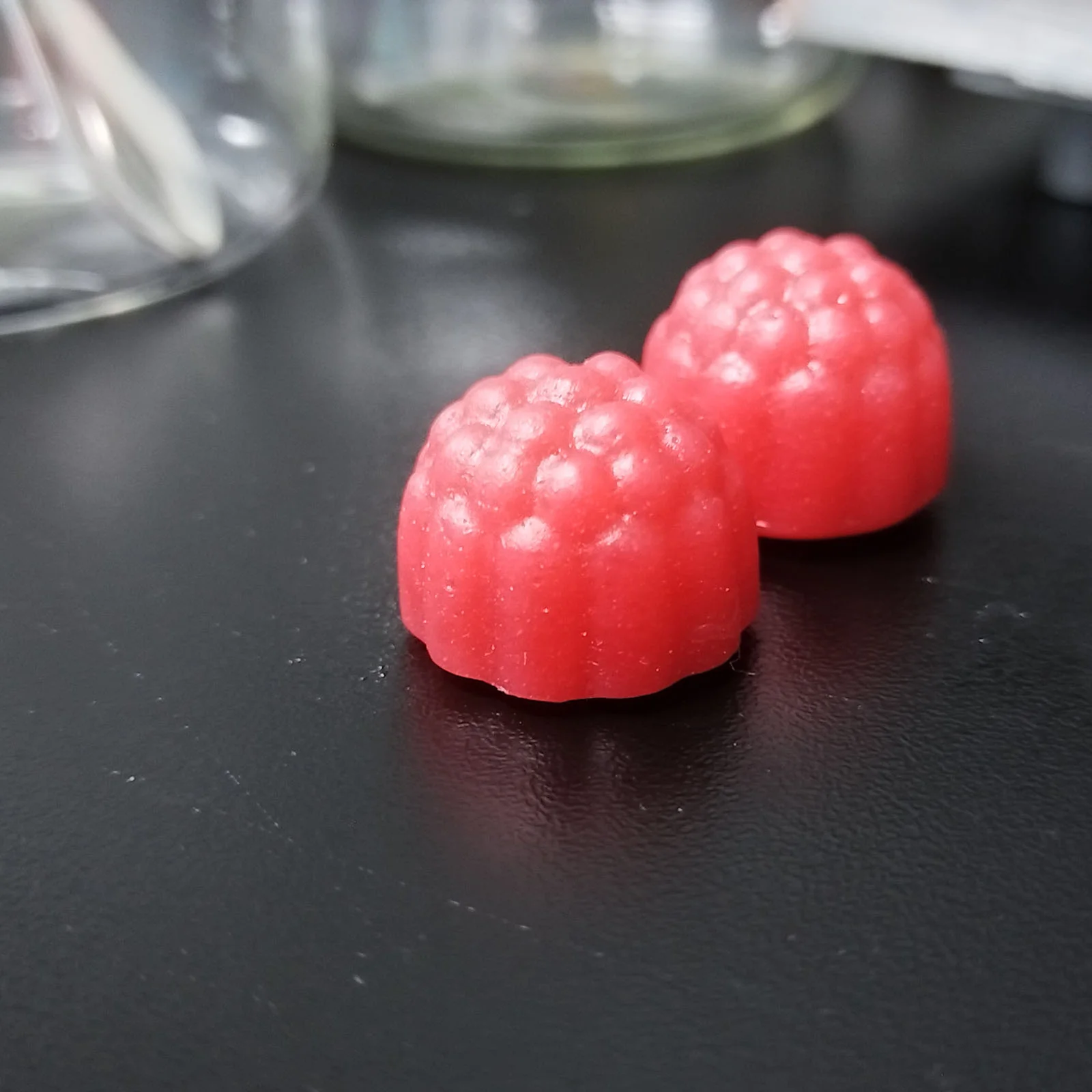 Red strawberry-flavored creatine gummy samples developed for private label supplement projects