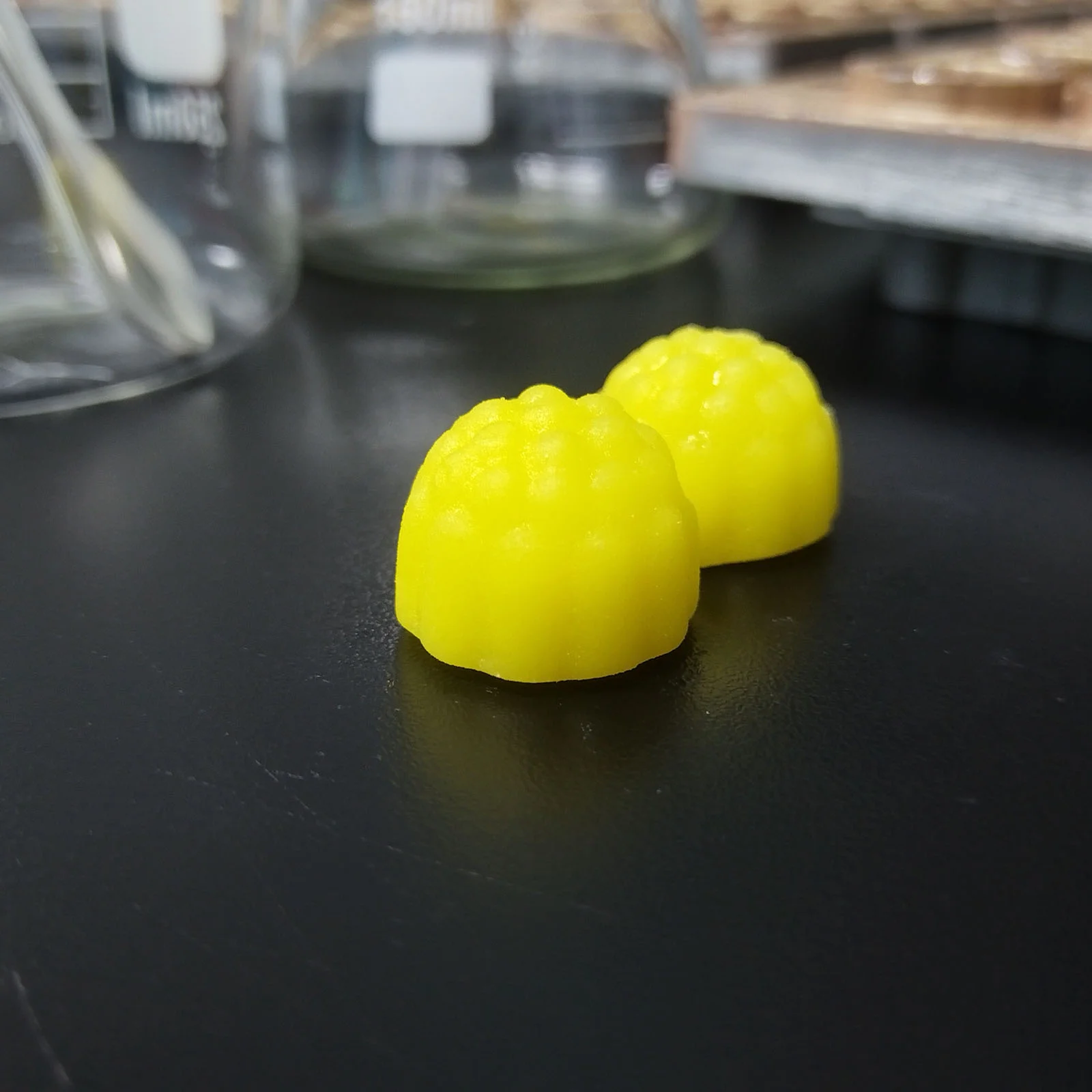 Yellow sour-flavored creatine gummy samples developed for private label supplement projects