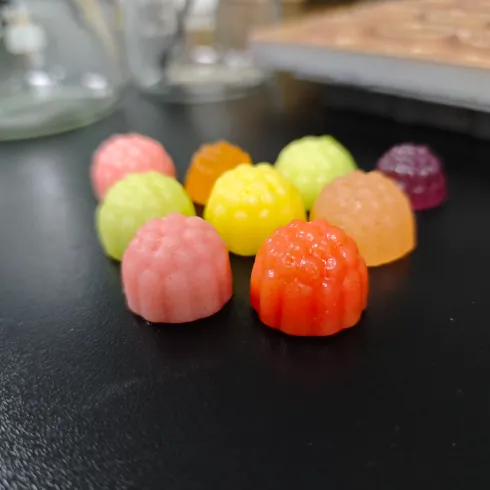 Colorful gummy samples representing more than 60 women-focused Daily Creatine Gummies formulas and custom multi-ingredient creatine gummy development.