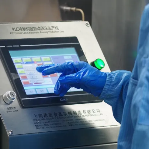 Operator controls dedicated mixing equipment used to add each ingredient at the optimal production stage for custom Daily Creatine Gummies with multiple nutrients.
