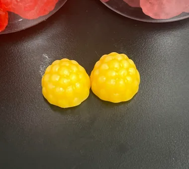 Two orange-yellow Creatine and Collagen Gummies with vitamin D3 and K2, using odorless collagen for women's healthy aging and skin-support product positioning.