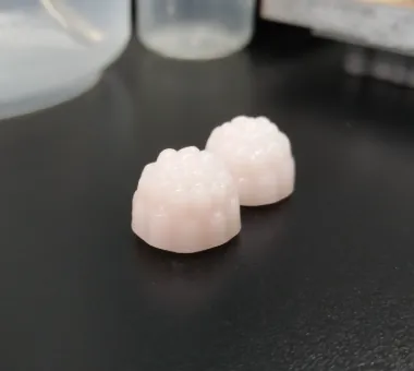 Two pale pink Creatine Gummies with Taurine, using a pectin and cellulose system for daily women's muscle-nutrition and sports product positioning.