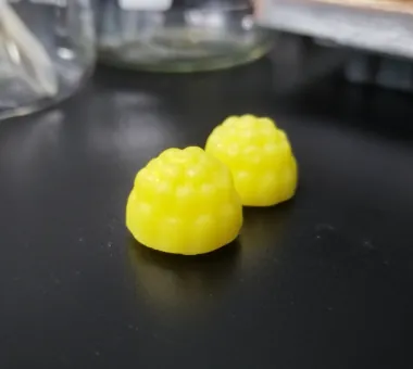 Two yellow berry-shaped Creatine Magnesium Zinc D3 B12 Gummies formulated per serving with 4 g creatine monohydrate, 75 mg magnesium glycinate, 8 mg zinc citrate, 1,000 IU vitamin D3 and 25 mcg vitamin B12.