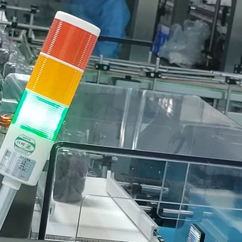 Purple gummy bottle moving through controlled production equipment during an elderberry gummy batch