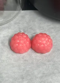Light pink gummy samples representing color comparison during an elderberry extract supplier change project
