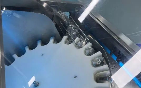 A gummy manufacturing machine with a circular transfer wheel