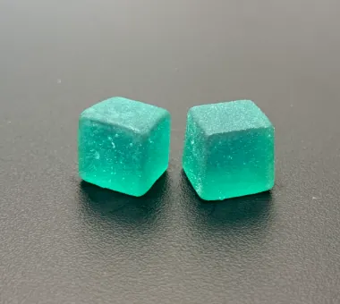 Teal cube-shaped gummy samples for vegan glutathione supplement product development