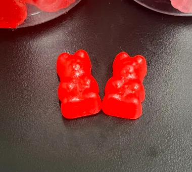 Red bear-shaped iron supplement gummies for custom daily dosage formulations