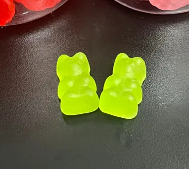 Green bear-shaped vegetarian iron gummies developed with a pectin-based gummy system