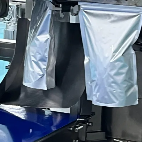 Silver stand-up pouches on automated packaging equipment