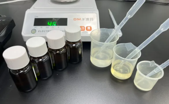 Berry flavor samples, droppers and test beakers used in sensory evaluation for private label magnesium glycinate gummies, including blueberry, raspberry and wild berry taste-masking options.