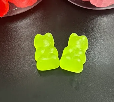 Two green bear-shaped calcium magnesium gummies combining magnesium glycinate and calcium citrate, with optional vitamin D3 for a diversified mineral gummy product line.