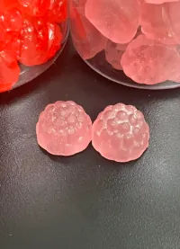 Translucent pink gummy samples for a sugar-free vegan melatonin gummy development project