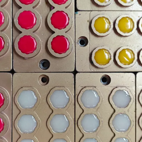 Pink, yellow and pale gummy formulations in molds, representing more than 60 adaptable stock formulas for combining mushroom ingredients with vitamins, minerals and other ingredients.