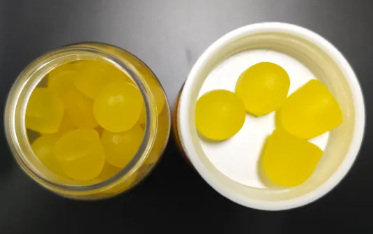 Yellow gummy samples in a bottle for a children’s probiotic gummies project using age-appropriate strains, no fiber or sugar alcohols, a one-gummy daily format and optional zinc gluconate.