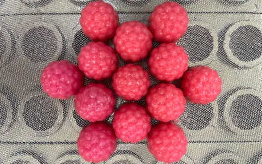 Pink gummy samples for a women’s probiotic product project using microencapsulation or late, low-temperature strain addition, with optional iron-gummy combination development.