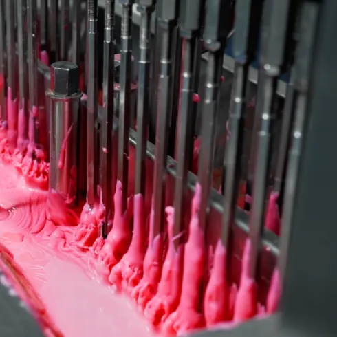 High-pressure depositing equipment forming protein gummy slurry during mass production, with staged ingredient addition engineered for uniform custom protein gummies.