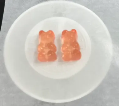 Pink sugar-free protein gummy bear samples formulated with maltitol or erythritol, helping reduce free-sugar reactions with protein and support zero-sugar product positioning.