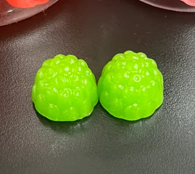Yellow-green gummy samples for a sea moss and apple cider vinegar gummy formula