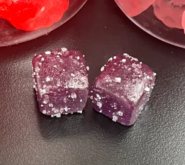 Deep-purple gummy samples for a sea moss and elderberry gummy formula