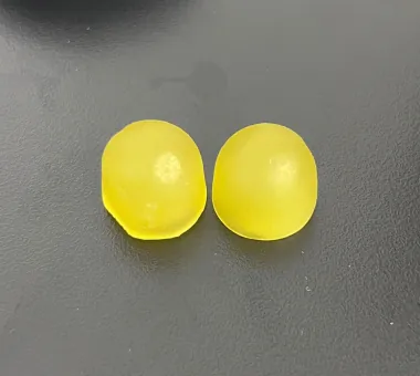 Two yellow round gummy samples displayed for the 3000 mg Shilajit Gummies product category