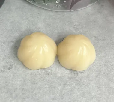 Two pale citrus-colored gummy samples displayed for a sugar free superfood gummy concept