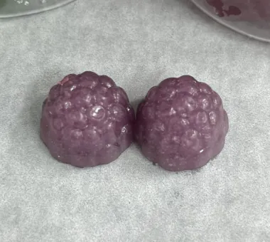 Two purple berry-shaped gummy samples for a prebiotic and probiotic superfood gummy concept