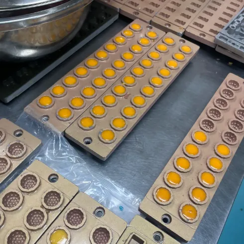 Golden gummy mould samples prepared for turmeric gummy scale-up and finished-specification verification