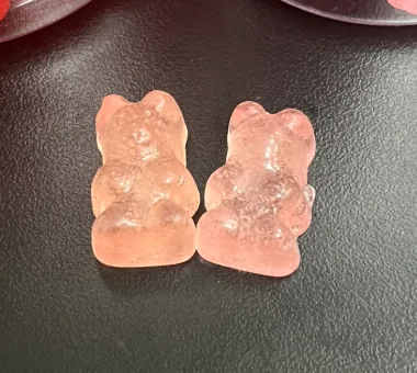Peach-orange bear-shaped gummies for a turmeric and ginger gummy formula