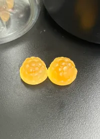 Amber-orange gummy samples for a turmeric and black pepper full-serving flavor trial