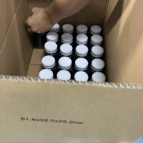 Sealed bottles packed by batch for traceable vitamin B12 gummies production and order management