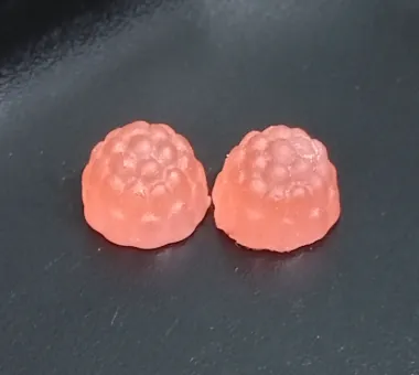 Small pink vitamin B12 gummies for kids with a soft round fruit shape
