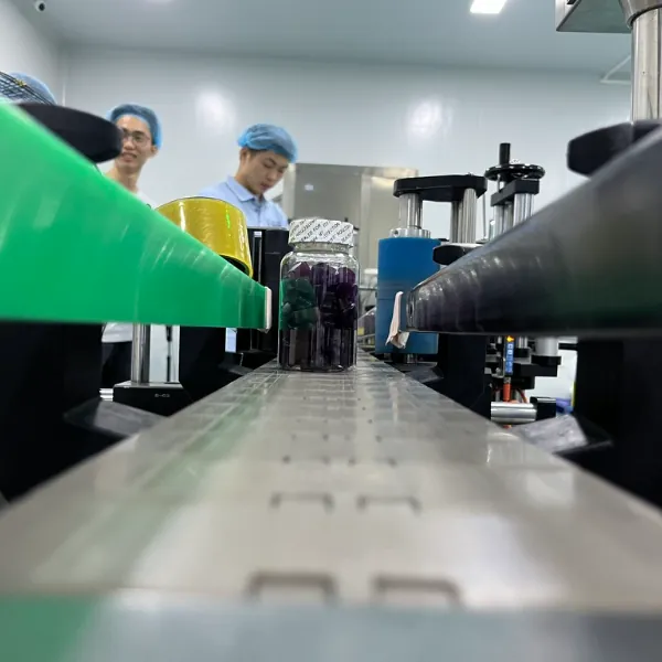 Production team monitors the gummy line during vitamin C OEM and ODM manufacturing