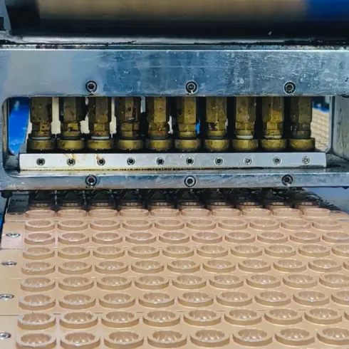 Gummy depositing equipment and molds used to evaluate high-load women's creatine gummy production