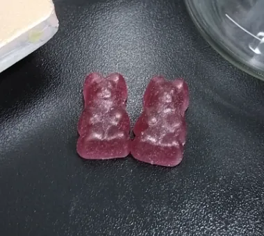 Purple bear-shaped gummy samples for blackberry blueberry creatine gummy formulations