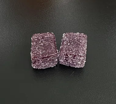 Purple gummy samples with assorted gummy jars for private label women's creatine gummy development