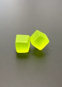 Yellow fruit-shaped gummy samples for mango passion fruit creatine gummy sensory evaluation